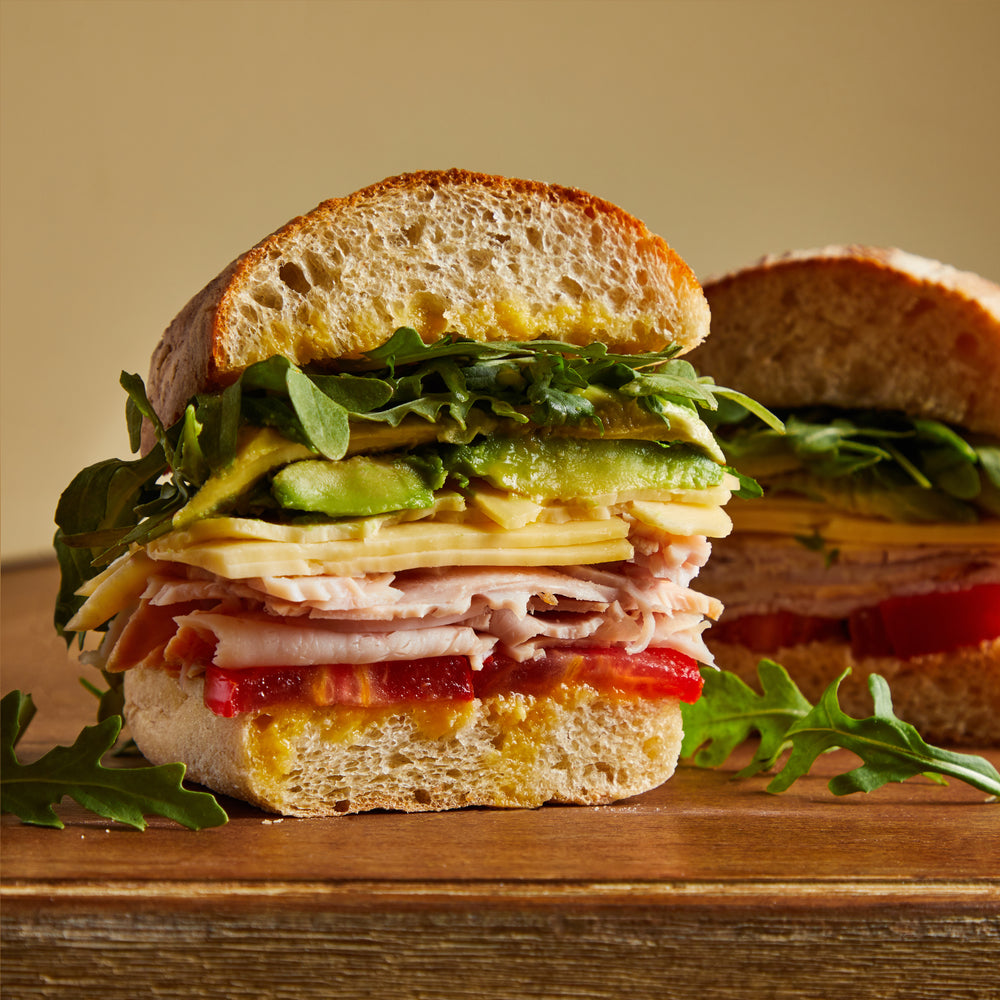 
            
                Load image into Gallery viewer, La Fromagerie - gourmet sandwich Californien turkey fontal cheese avocado habanero hot sauce 
            
        